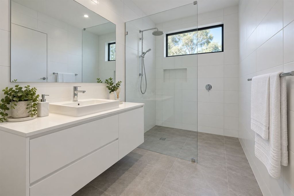 Sparkling clean bathroom with clear shower glass after cleaning
