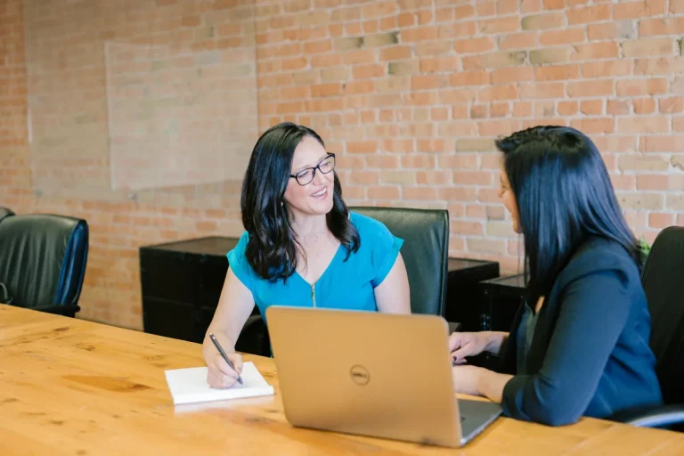 Customer discussing a cleaning booking at a laptop